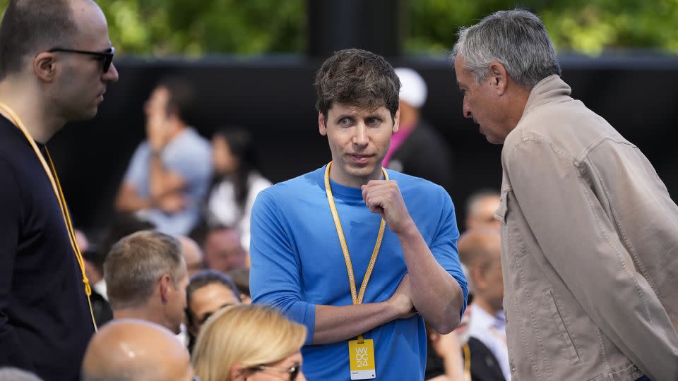 OpenAI CEO Sam Altman, center, attends an Apple event in Cupertino, Calif., Monday, June 10, 2024. - Jeff Chiu/AP