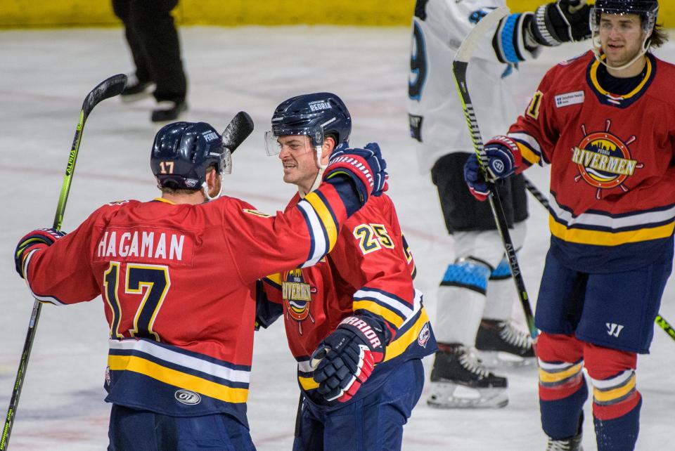 Peoria's Alec Hagaman (17) congratulates teammate Nick Neville (25) on a goal in the second period Sunday, Jan. 16, 2022 at Carver Arena. The Rivermen beat the Quad City Storm 7-4.