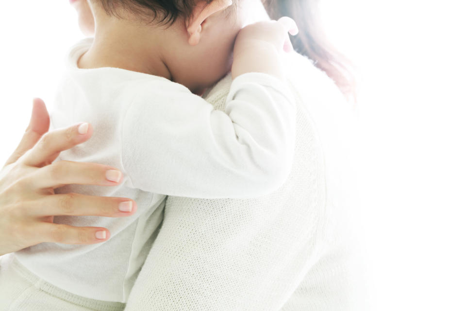 A mother comforting a baby