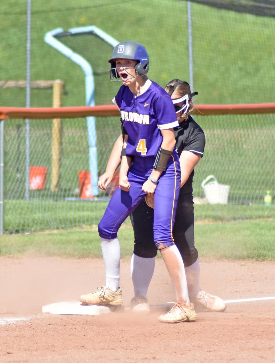 Bronson's Ashlynn Harris lets our a yell after a big triple helped get Bronson on the board versus Quincy on Wedneaday