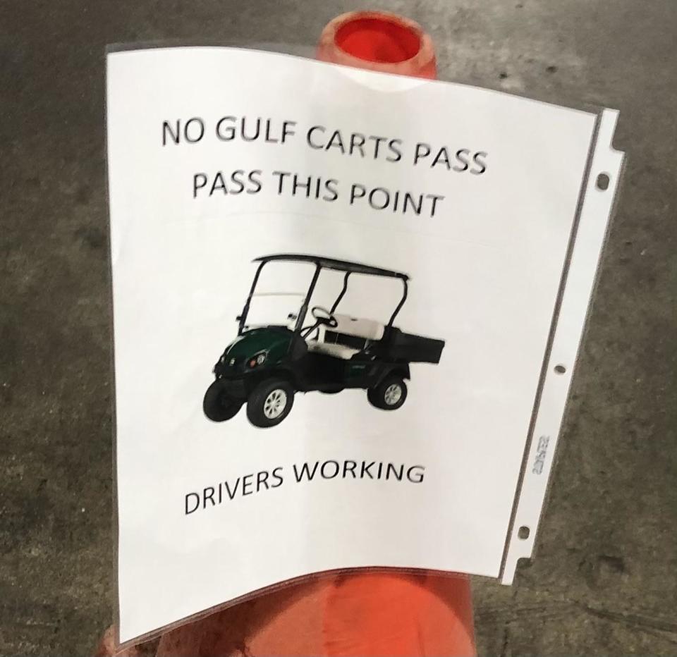 Sign that says, "No gulf carts pass pass this point drivers working"