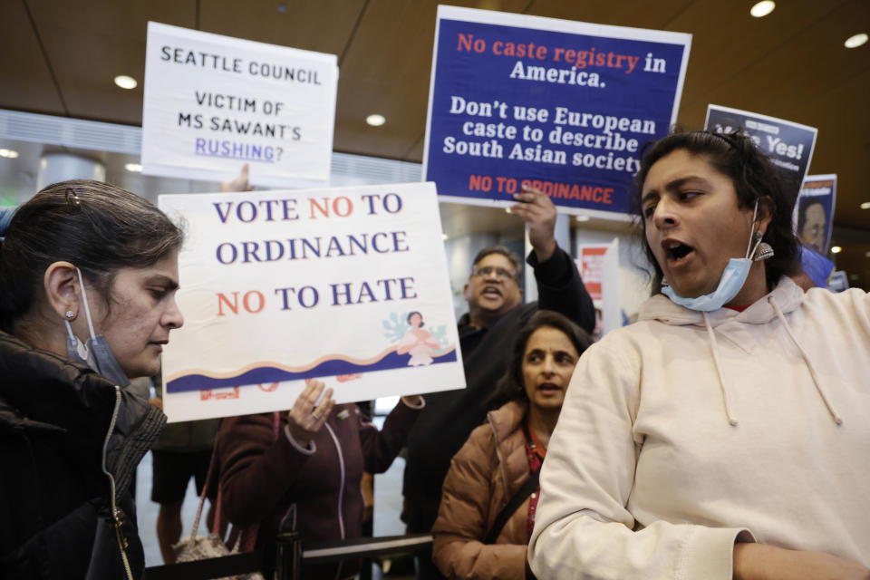 Supporters and opponents of a proposed ordinance to add caste to Seattle's anti-discrimination laws attempt to out voice each other during a rally at Seattle City Hall, Tuesday, Feb. 21, 2023, in Seattle. Councilmember Kshama Sawant proposed the ordinance. (AP Photo/John Froschauer)
