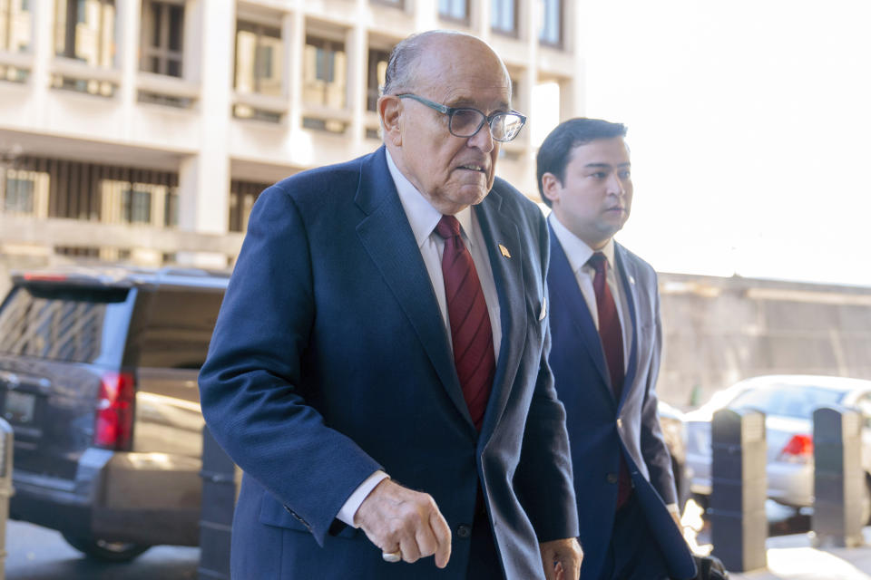 Former Mayor of New York Rudy Giuliani arrives at the federal courthouse in Washington, Monday, Dec. 11, 2023. The trial will determine how much Giuliani will have to pay two Georgia election workers who he falsely accused of fraud while pushing President Donald Trump's baseless claims after he lost the 2020 election. (AP Photo/Jose Luis Magana)