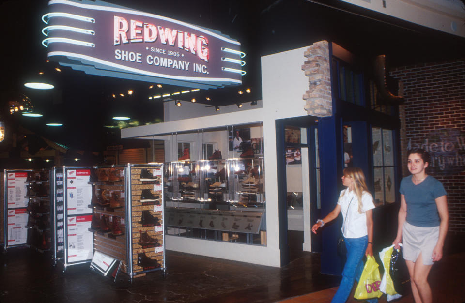 354894 54: Shoppers pass by Red Wing Shoe Company June, 1999 inside the Mall of America in Minneapolis, MN. Red Wing shoes are a popular brand in Japan and are must-haves for japanese tourists. Mall of America is the largest in the country and attracts over 43 million people per year with its retail and entertainment complex. (Photo by Carolyn Schaefer/Liaison)