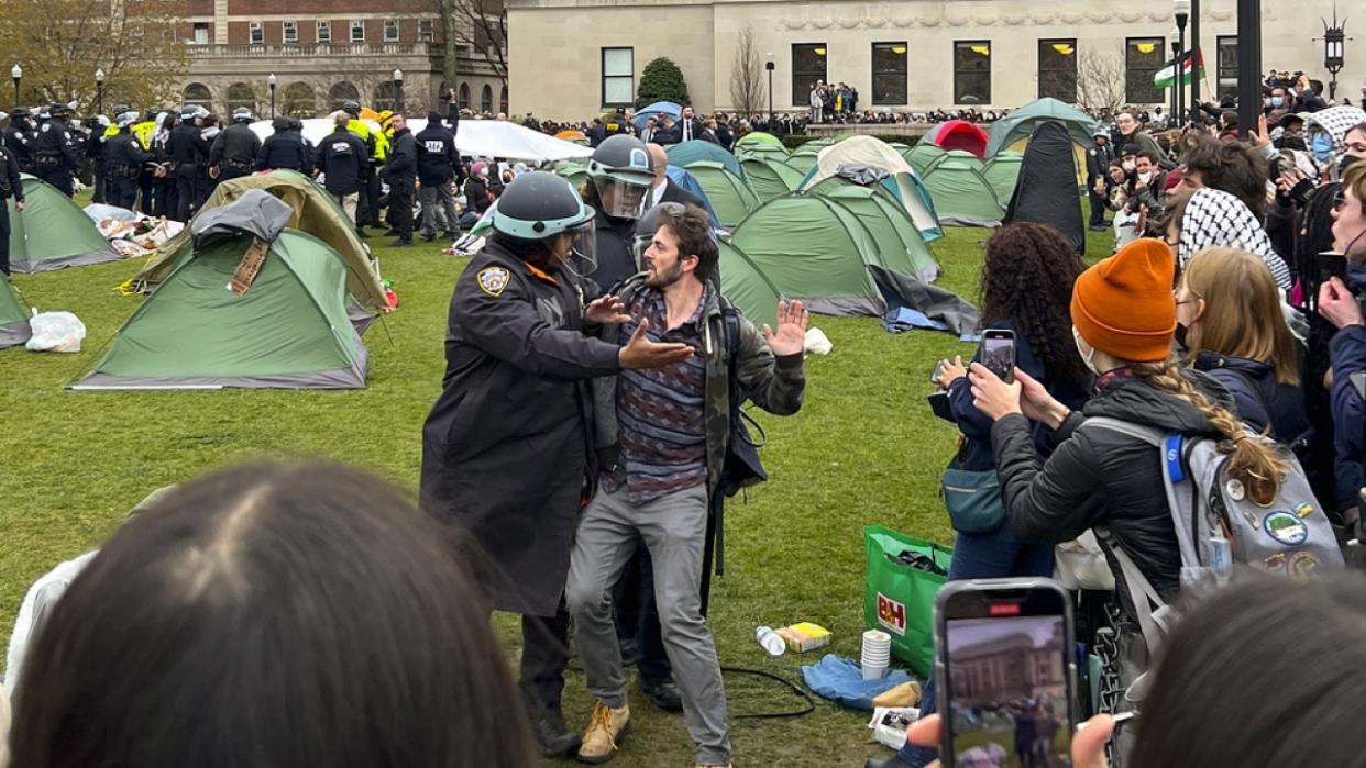 New York Police officers arrest a protester on the Columbia University campus.
