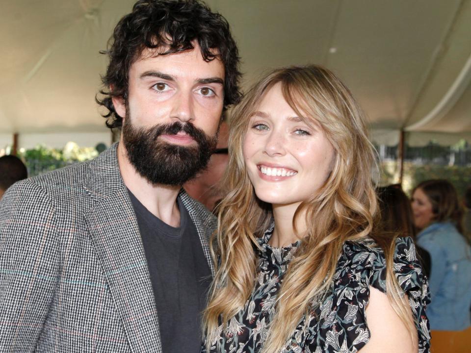 Robbie Arnett and Elizabeth Olsen posing together in Beverly Hills in October 2019.