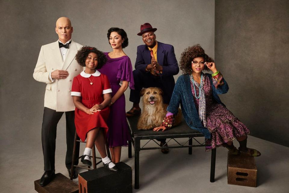 "Annie Live!" cast members Harry Connick Jr., left, Celina Smith, Nicole Scherzinger, Tituss Burgess, Sandy the dog, and Taraji P. Henson in costume ahead of Thursday's live broadcast on NBC.