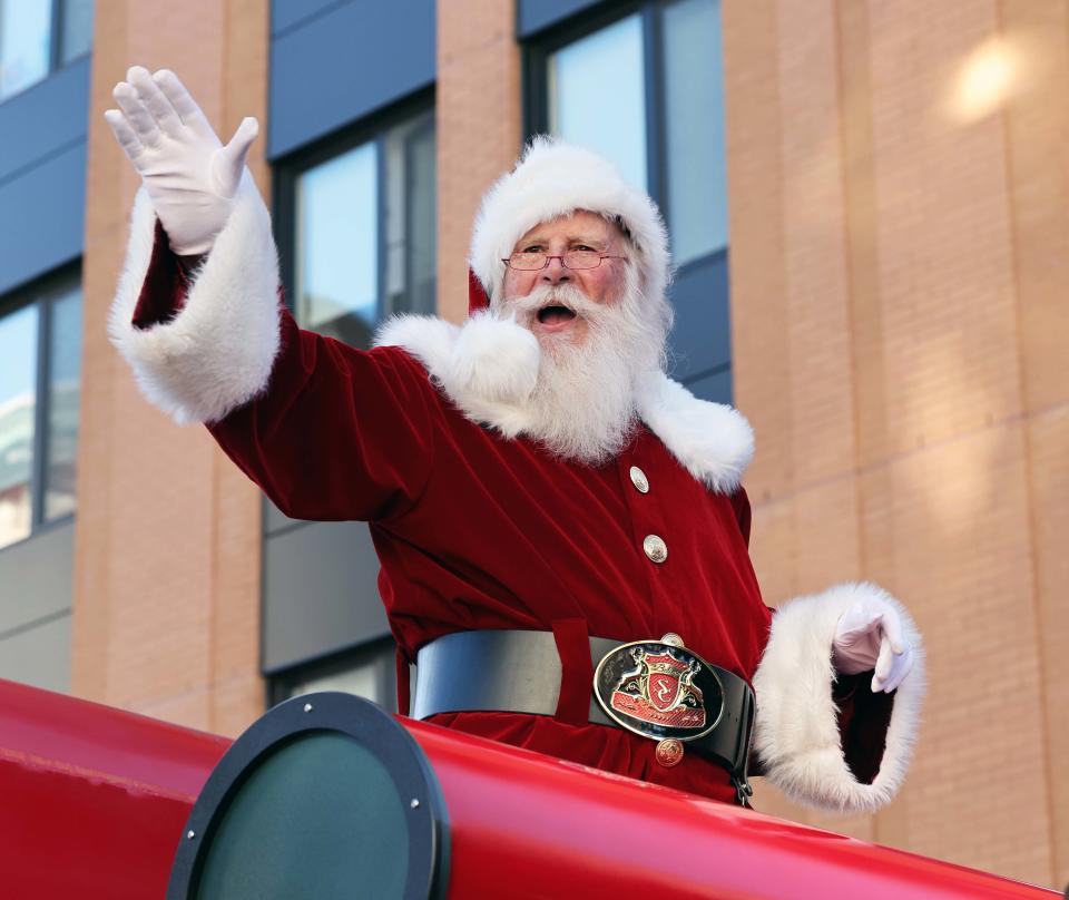 Santa waves to spectators during the 35th annual Community Holiday Parade and Celebration, hosted by the Downtown Brockton Association and the City of Brockton, on Saturday, Nov. 26, 2022.