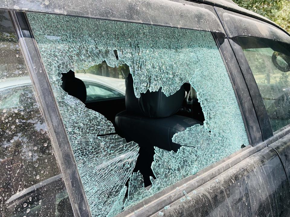 KABUL, AFGHANISTAN - AUGUST 18: A damaged car is seen at the scene of a landed rocket after a rocket attack in downtown Kabul, Afghanistan, on August 18, 2020. The rockets were fired from two vehicles located in different areas targeting the residential areas of the city as some were injured, officials said. (Photo by Haroon Sabawoon/Anadolu Agency via Getty Images)