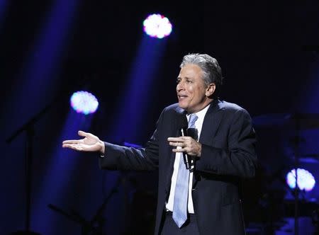 Comedian Jon Stewart speaks during the "12-12-12" benefit concert for victims of Superstorm Sandy at Madison Square Garden in New York in this file photo from December 12, 2012. REUTERS/Lucas Jackson/Files