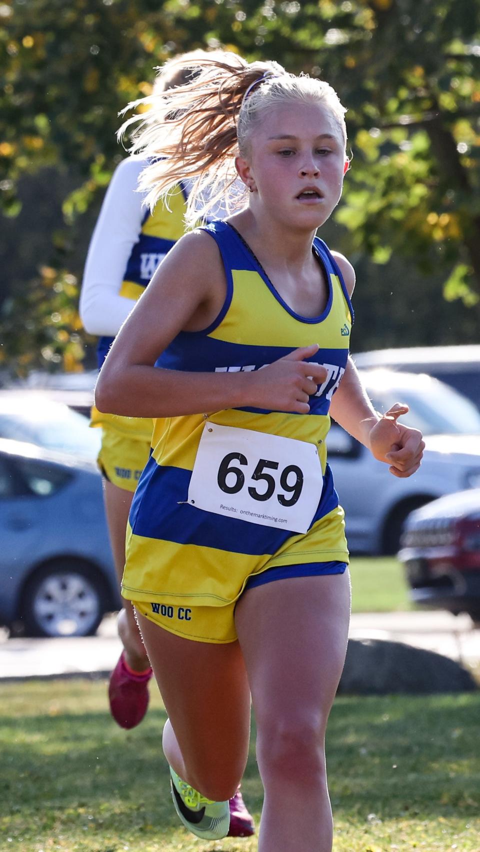 Wooster's Mattie Dunlap races her way to eighth at the Wayne-Holmes Invitational to help her team to the team win.