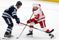 Detroit Red Wings forward Darren Helm, right, works against Columbus Blue Jackets defenseman Michael Del Zotto during the first period of an NHL hockey game in Columbus, Ohio, Friday, May 7, 2021. (AP Photo/Paul Vernon)