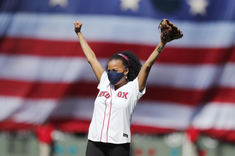 Acting Mayor of Boston Kim Janey reacts after throwing out the ceremonial first pitch before an opening day baseball game between the Boston Red Sox and the Baltimore Orioles, Friday, April 2, 2021, in Boston. (AP Photo/Michael Dwyer)