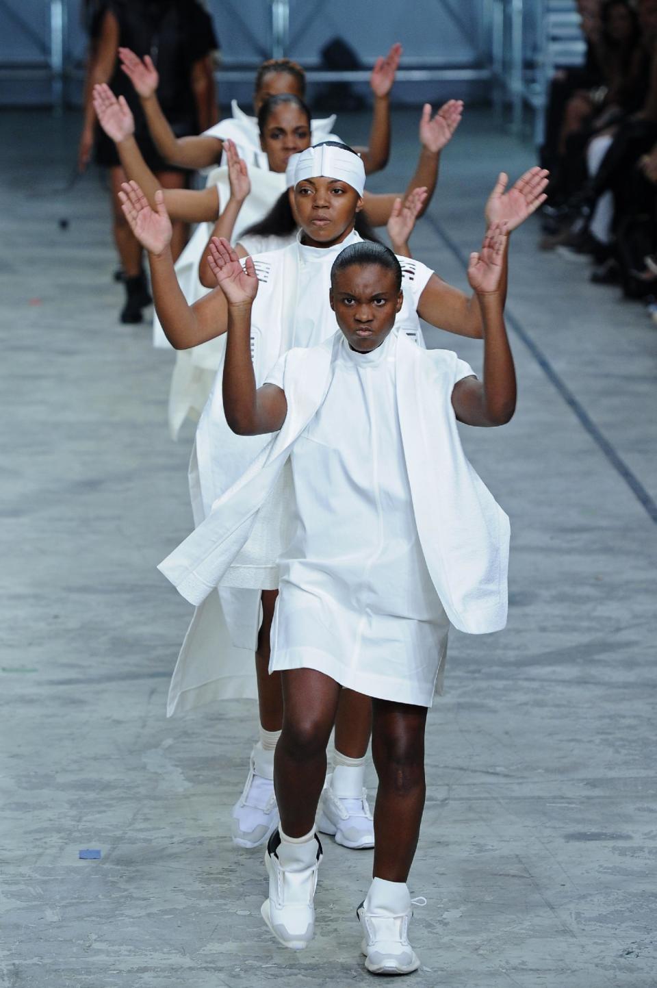 Models present creations as part of fashion designer Rick Owens ready-to-wear Spring/Summer 2014 fashion collection presented in Paris, Thursday, Sept. 26, 2013. (AP Photo/Zacharie Scheurer)