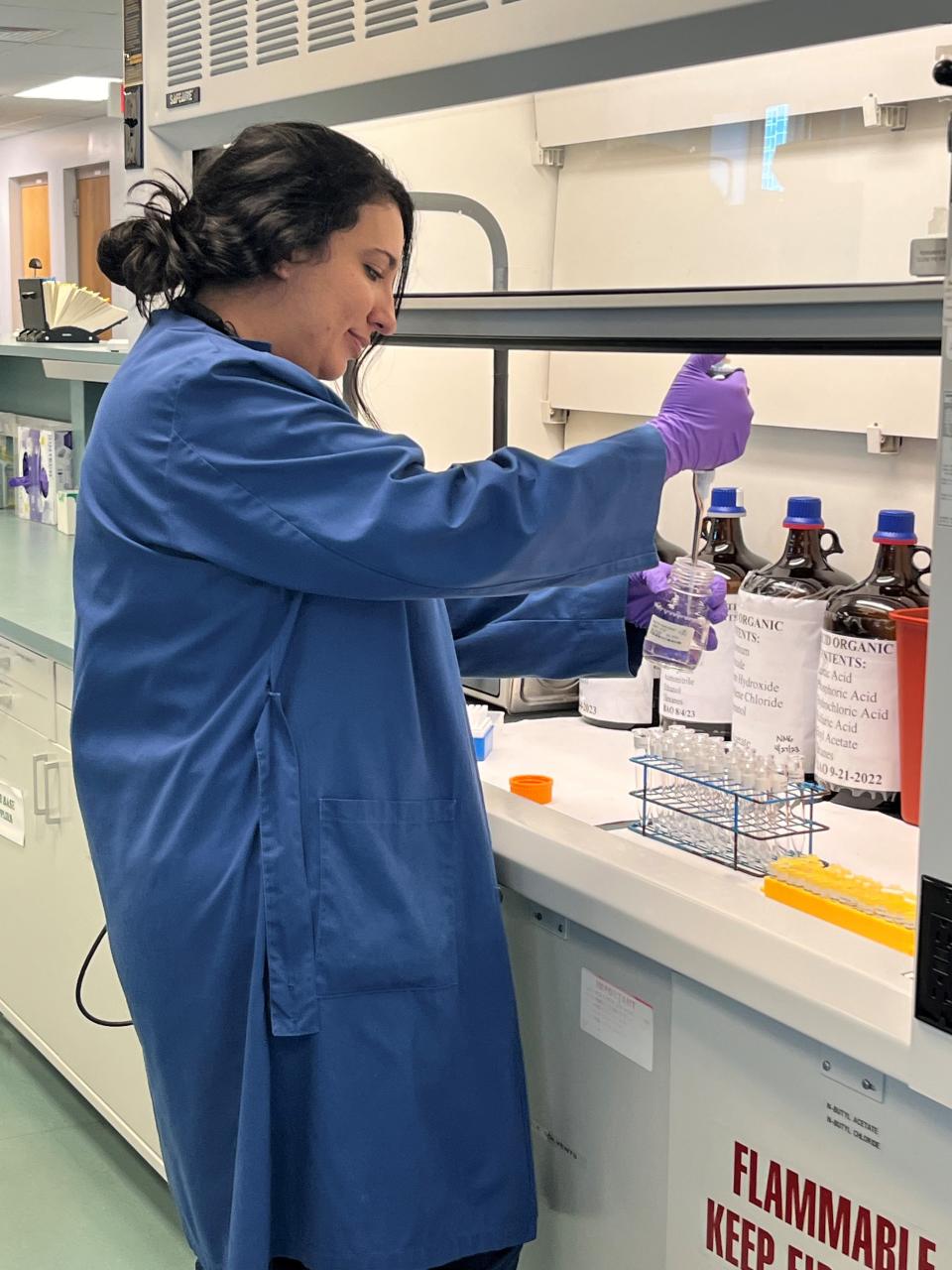 FDLE Analyst Linet Kamandulis preparing toxicology samples for an extraction and analysis.
(Credit: Photo provided)