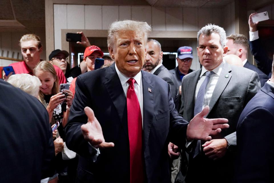 Former President Donald Trump greets supporters before speaking at the Westside Conservative Breakfast, Thursday, June 1, 2023, in Des Moines, Iowa. (AP Photo/Charlie Neibergall)