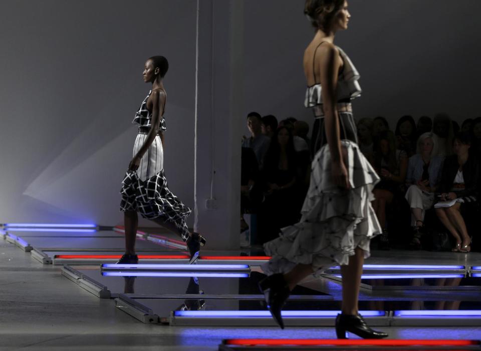 The Rodarte Spring 2014 collection is modeled during Fashion Week in New York, Tuesday, Sept. 10, 2013. (AP Photo/Seth Wenig)