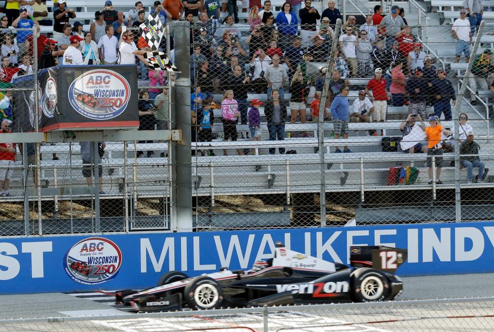 Will Power takes the checkered flag as he wins the 2014 race at the Milwaukee Mile, the second-last IndyCar race held at the track on the grounds of State Fair Park in West Allis.