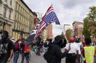 Black Lives Matter protesters march, Friday, Sept. 25, 2020, in Louisville. Breonna Taylor's family demanded Friday that Kentucky authorities release all body camera footage, police files and the transcripts of the grand jury hearings that led to no charges against police officers who killed the Black woman during a March drug raid at her apartment. (AP Photo/Darron Cummings)