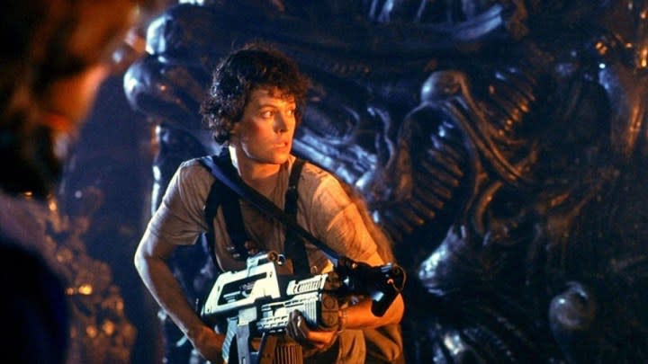 A woman holds a gun in Aliens.