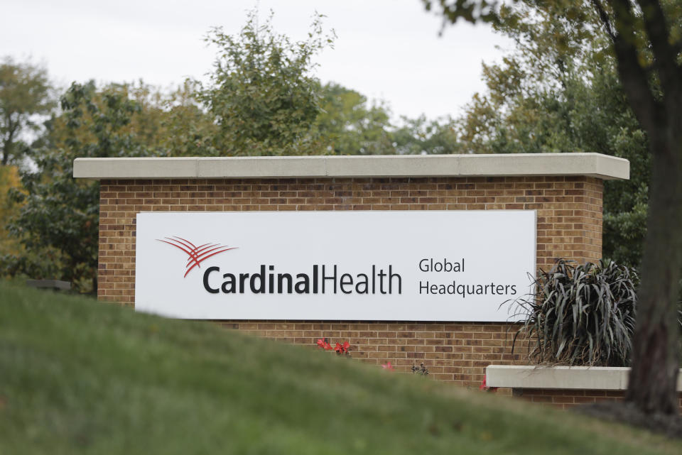 A sign is displayed at the Cardinal Health, Inc. corporate office Wednesday, Oct. 16, 2019, in Dublin, Ohio. Shares of big drug distributors soared Wednesday on word of a potential settlement ahead of the first federal trial over the opioid crisis. Two people with knowledge of the negotiations, which have lasted months, confirmed to The Associated Press that McKesson Corp., AmerisourceBergen Corp., and Cardinal Health, Inc., have offered $18 billion over 18 years to settle more than 2,000 lawsuits across the country. (AP Photo/Darron Cummings)