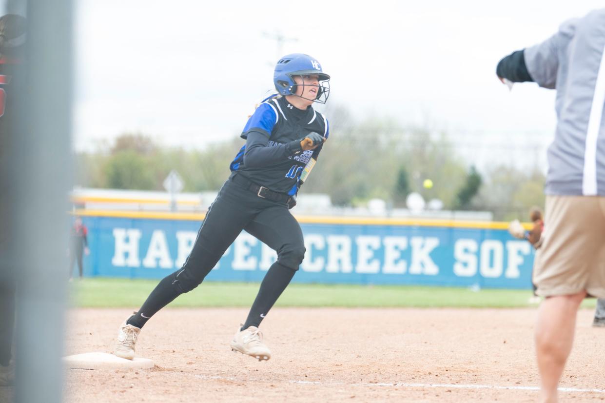 Harper Creek sophomore Kennedy Halverson rounds third base during a game against Jackson Northwest at Harper Creek High School on Tuesday, April 23, 2024.