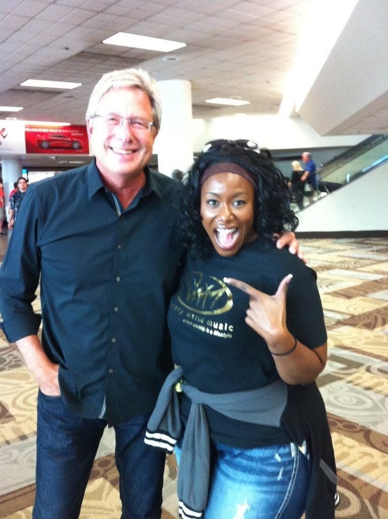 Praise and worship leader Don Moen poses for a photo with Mandisa at the airport during a recent tour the two did together.