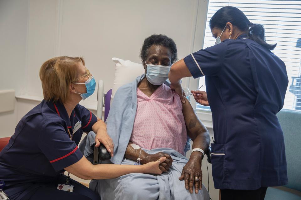 Josephine Faleye, 80, receiving the Pfizer-BioNTech Covid-19 vaccine at the Royal Free hospital in north London (PA)