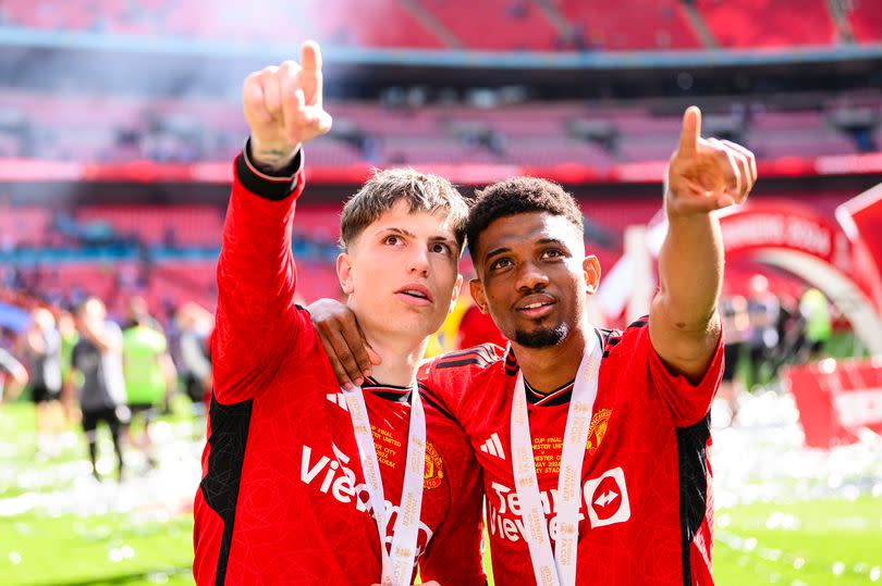 Alejandro Garnacho and Amad point into the stands at Wembley after the FA Cup final in May.