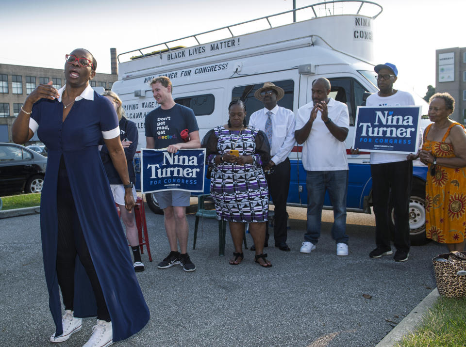 In this July 7, 2021, photo Nina Turner, a candidate running in a special Democratic primary election for Ohio's 11th Congressional District speaks with supporters near the Cuyahoga County Board of Elections before casting her vote in Cleveland. (AP Photo/Phil Long)