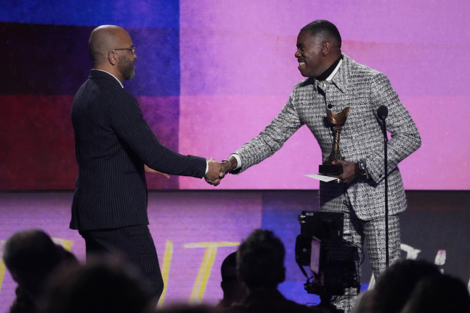 Colman Domingo, right, presents the award for best lead performance to Jeffrey Wright for "American Fiction" during the Film Independent Spirit Awards on Sunday, Feb. 25, 2024, in Santa Monica, Calif. (AP Photo/Chris Pizzello)