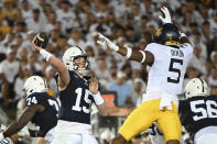 Penn State quarterback Drew Allar (15) passes while pressured by West Virginia linebacker Lance Dixon (5) during the second half of an NCAA college football game, Saturday, Sept. 2, 2023, in State College, Pa. (AP Photo/Barry Reeger)