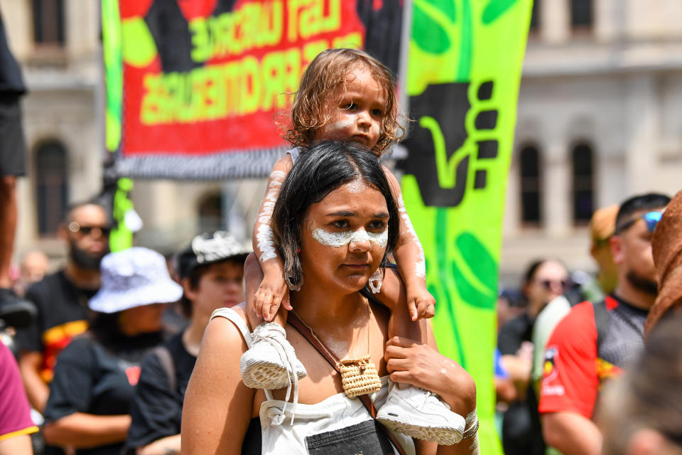 A young woman and child at the same Brisbane rally. Source: AAP