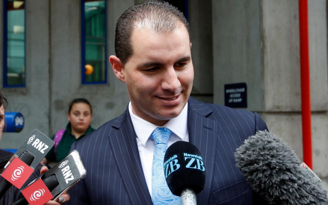 New Zealand's former lawmaker Jami-Lee Ross talks to reporters outside Wellington Central Police Station on Wednesday - AP