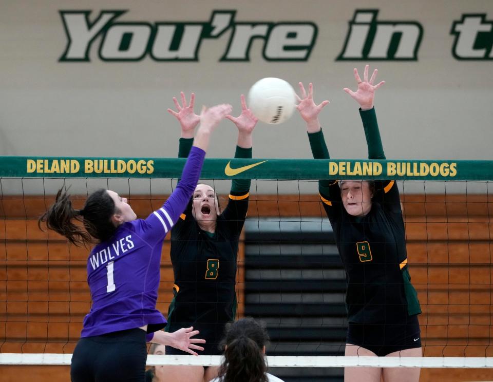 DeLand's Alison Bierwagen (8) and Cora Hamilton (9) go up for the block during a game with Timber Creek at DeLand High School, Wednesday, Oct. 26, 2022.