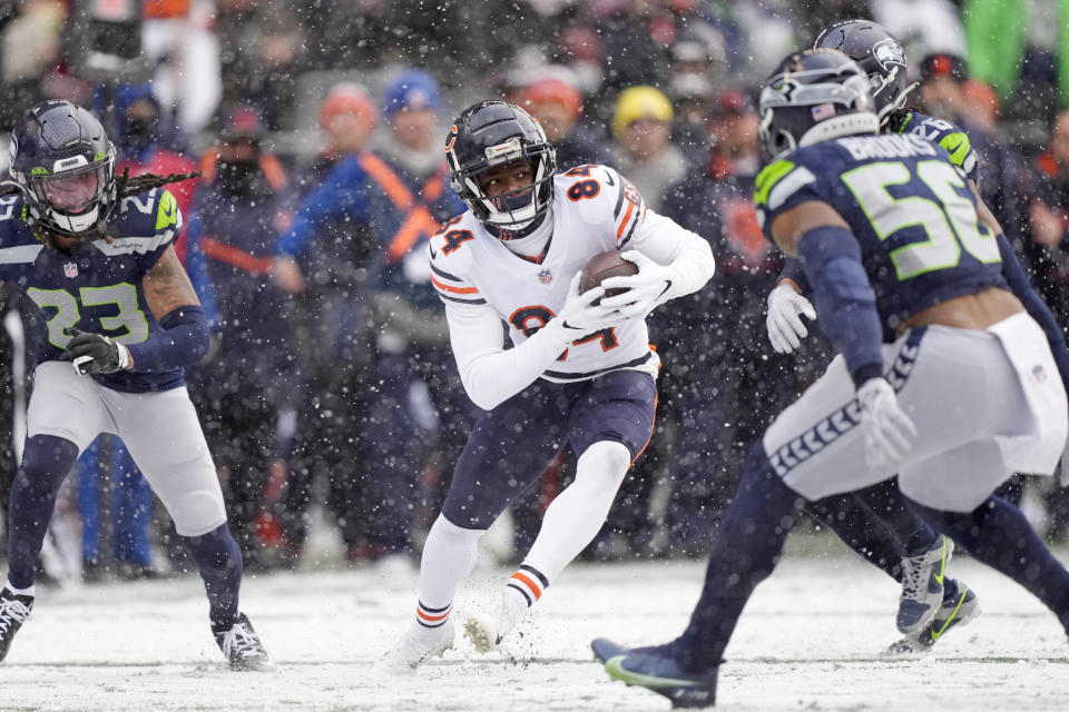 Chicago Bears wide receiver Marquise Goodwin (84) runs with the ball against the Seattle Seahawks during the first half of an NFL football game, Sunday, Dec. 26, 2021, in Seattle. (AP Photo/Stephen Brashear)