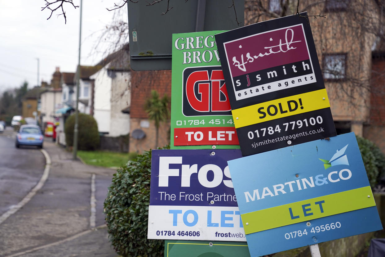 A general view of estate agent boards outside a property in Staines-upon-Thames in Surrey. Picture date: Monday January 10, 2022.