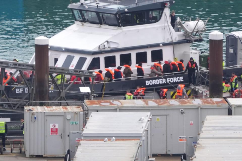 A group of people thought to be migrants are brought in to Dover, Kent, from a Border Force vessel (PA) (PA Wire)