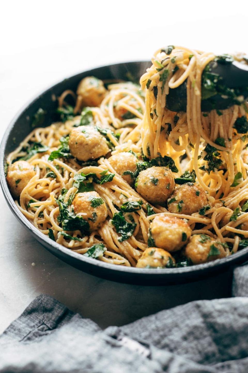 <strong>Get the <a href="https://pinchofyum.com/garlic-herb-spaghetti-chicken-meatballs" target="_blank" rel="noopener noreferrer">Garlic Herb Spaghetti With Chicken and Meatballs</a>&nbsp;recipe from Pinch of Yum.</strong>