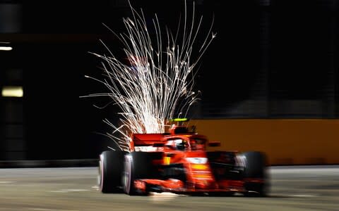 Sparks fly behind Kimi Raikkonen of Finland driving the (7) Scuderia Ferrari SF71H on track during practice for the Formula One Grand Prix of Singapore at Marina Bay Street Circuit on September 14, 2018 in Singapore - Credit: Clive Mason/Getty Images