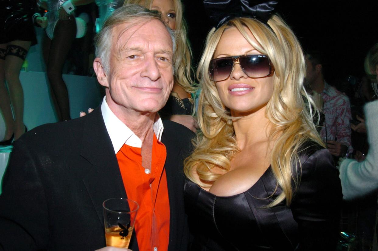 Hugh Hefner and Pamela Anderson during Playboy's 50th Anniversary Celebration in New York City - Inside at New York Armory in New York City, New York, United States. (Photo by Theo Wargo/WireImage)