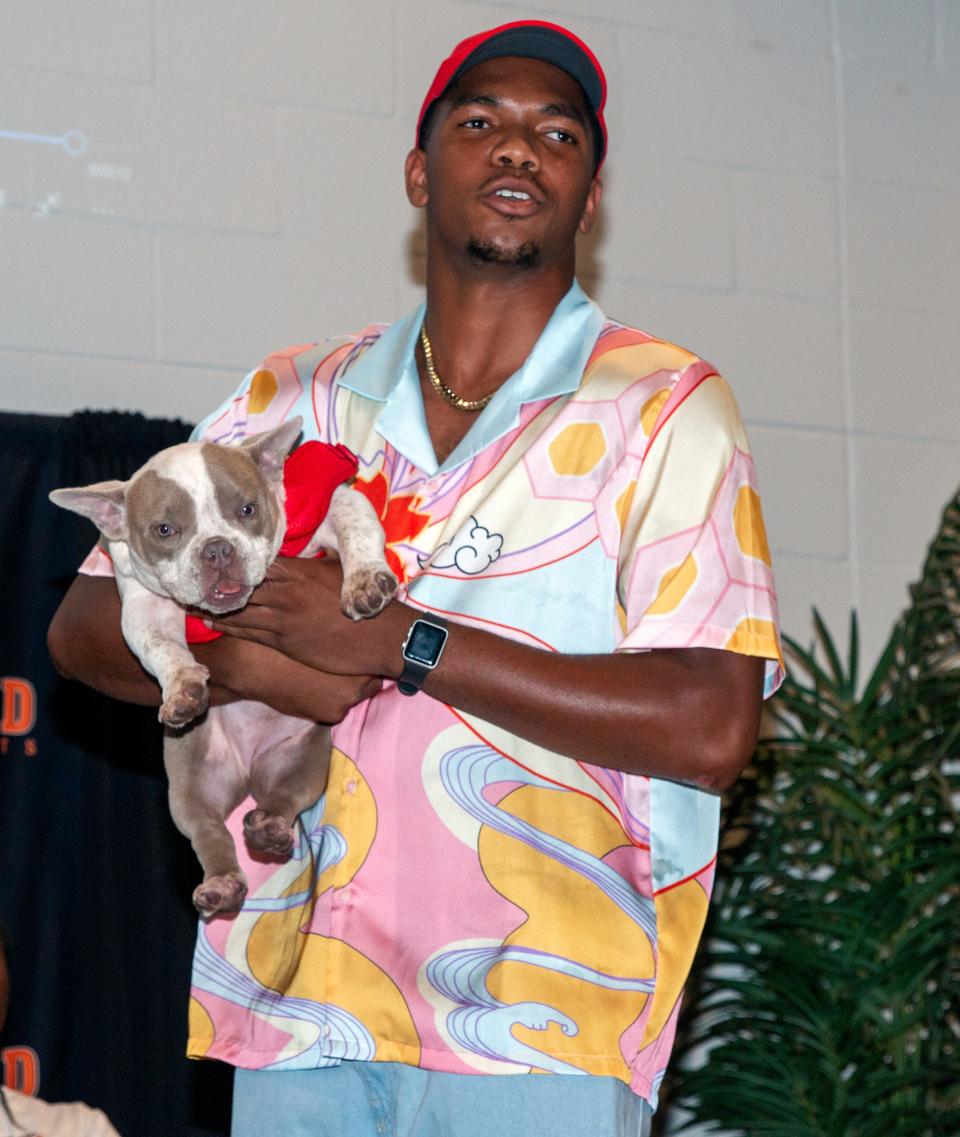 Lakeland senior wide receiver Tyler Williams shows off a Bulldog as he committed to Georgia on Tuesday night at The Well in Lakeland.