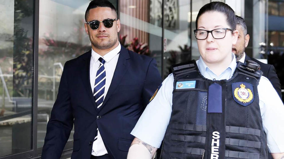 Jarryd Hayne was escorted by a police officer. Image: AAP