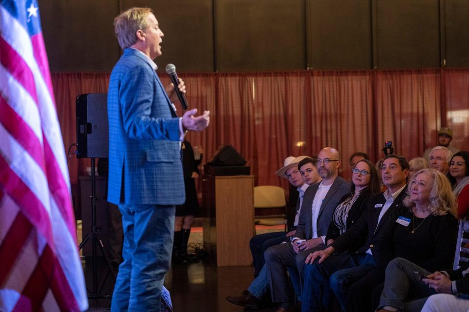 Tom Glass listens as Attorney General Ken Paxton speaks during Glass' campaign event for Texas State Representative District 17 at Film Alley in Bastrop on Wednesday, Jan. 24, 2024.