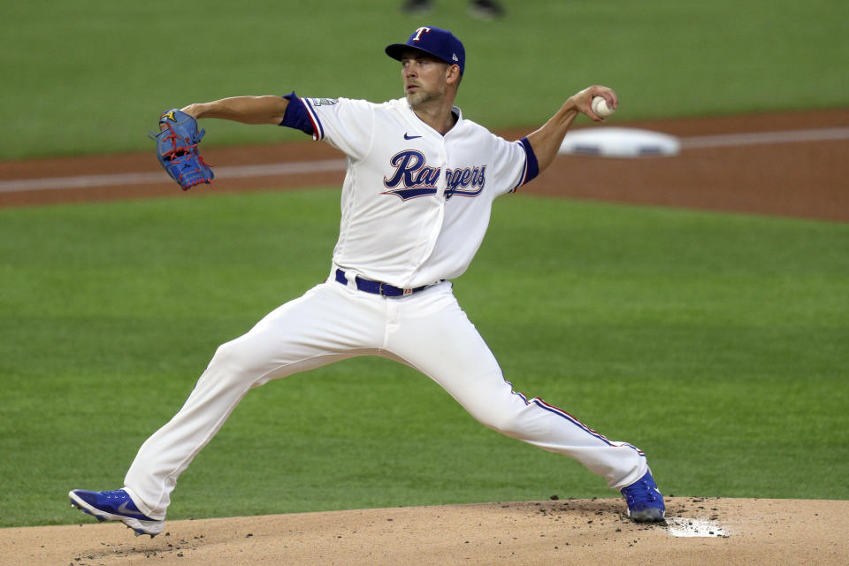 Texas Rangers starting pitcher Mike Minor delivers in the first inning against the Colorado Rockies in a baseball game Saturday, July 25, 2020, in Arlington, Texas. (AP Photo/Richard W. Rodriguez)