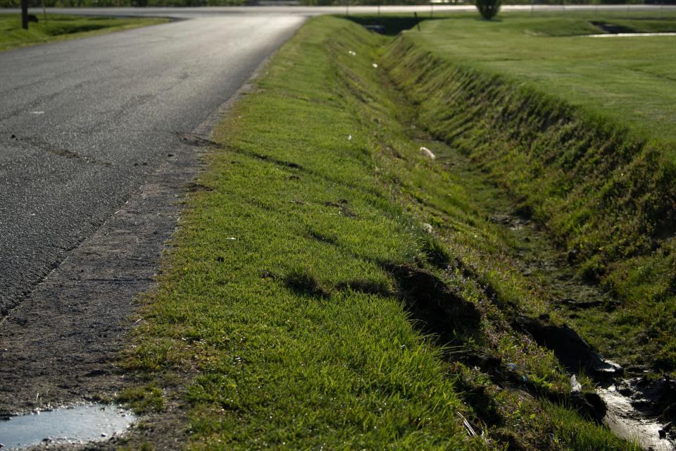 Muddy tracks mark the spot where the Cadillac sedan fugitives Casey White and Vicky White, no relation, were driving when law enforcement officials forced them into a ditch at Burch Drive in Evansville, Ind., after a short chase Monday evening, May 9, 2022. The two have been on the run since Vicky White, a detention officer, helped the inmate Casey White escape the Lauderdale County Detention Center April 28, 2022.