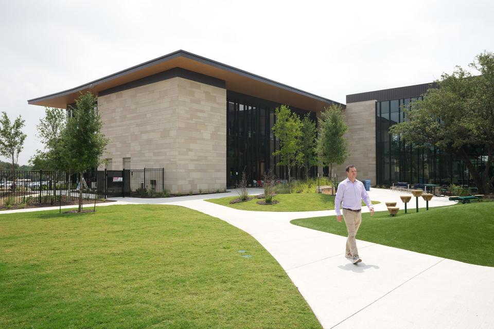 Rabbi Daniel Septimus walks in the courtyard at the Dell Jewish Community Center on the Shalom Austin campus Thursday. The center lends the campus a new identity and gives visitors a sense of where to enter the enclosed compound.