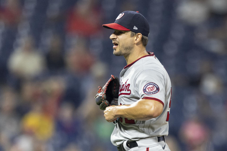 Washington Nationals closing pitcher Brad Hand reacts to the team's 6-4 win over the Philadelphia Phillies in a baseball game, Tuesday, July 27, 2021, in Philadelphia. (AP Photo/Laurence Kesterson)