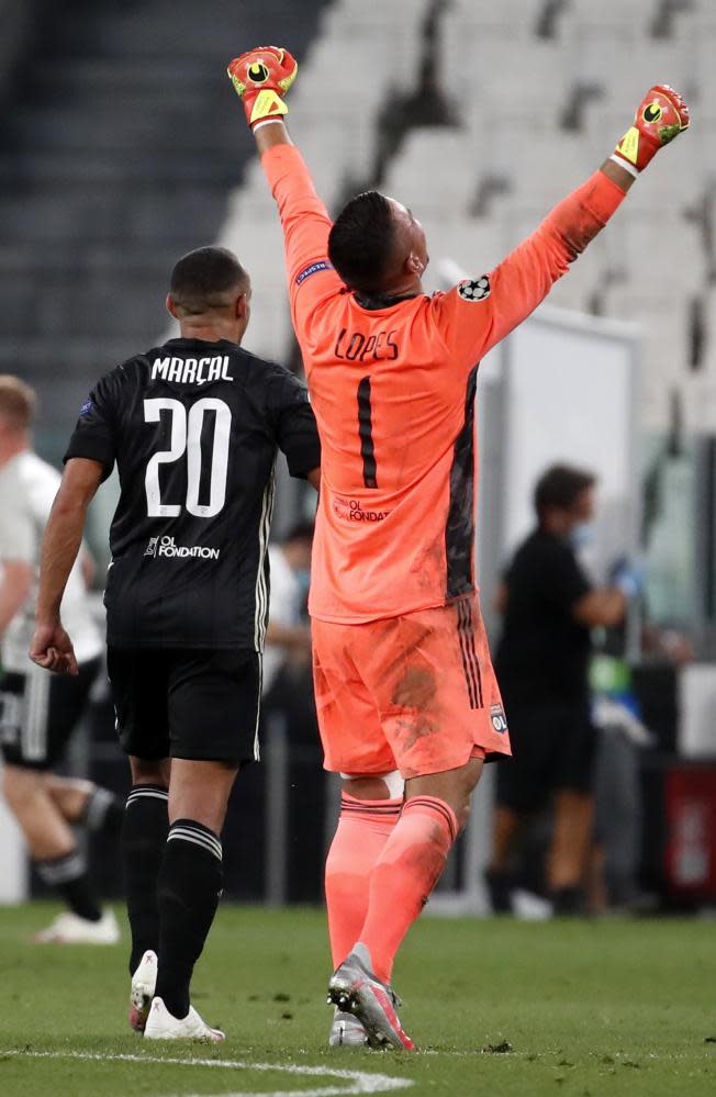 Lyon’s goalkeeper Anthony Lopes celebrates after the Champions League last-16 second leg against Juventus