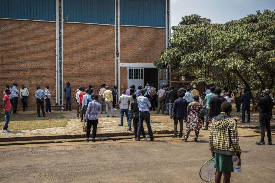 People queue to get tested for COVID-19 at a testing center in the capital Kigali, Rwanda, Tuesday, July 28, 2020. Like many countries, Rwanda is finding it impossible to test each of its citizens for the coronavirus amid shortages of supplies but researchers there have created an innovative approach using an algorithm to refine the process of pooled testing that's drawing attention beyond the African continent. (AP Photo)